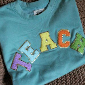 Boutique "TEACH" Sweatshirt (NWOT)